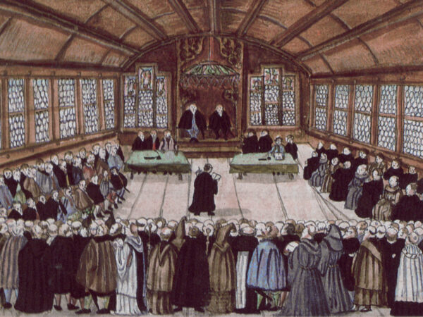 Zwingli and the Zurich council meet around a table to debate the faith in 1523.