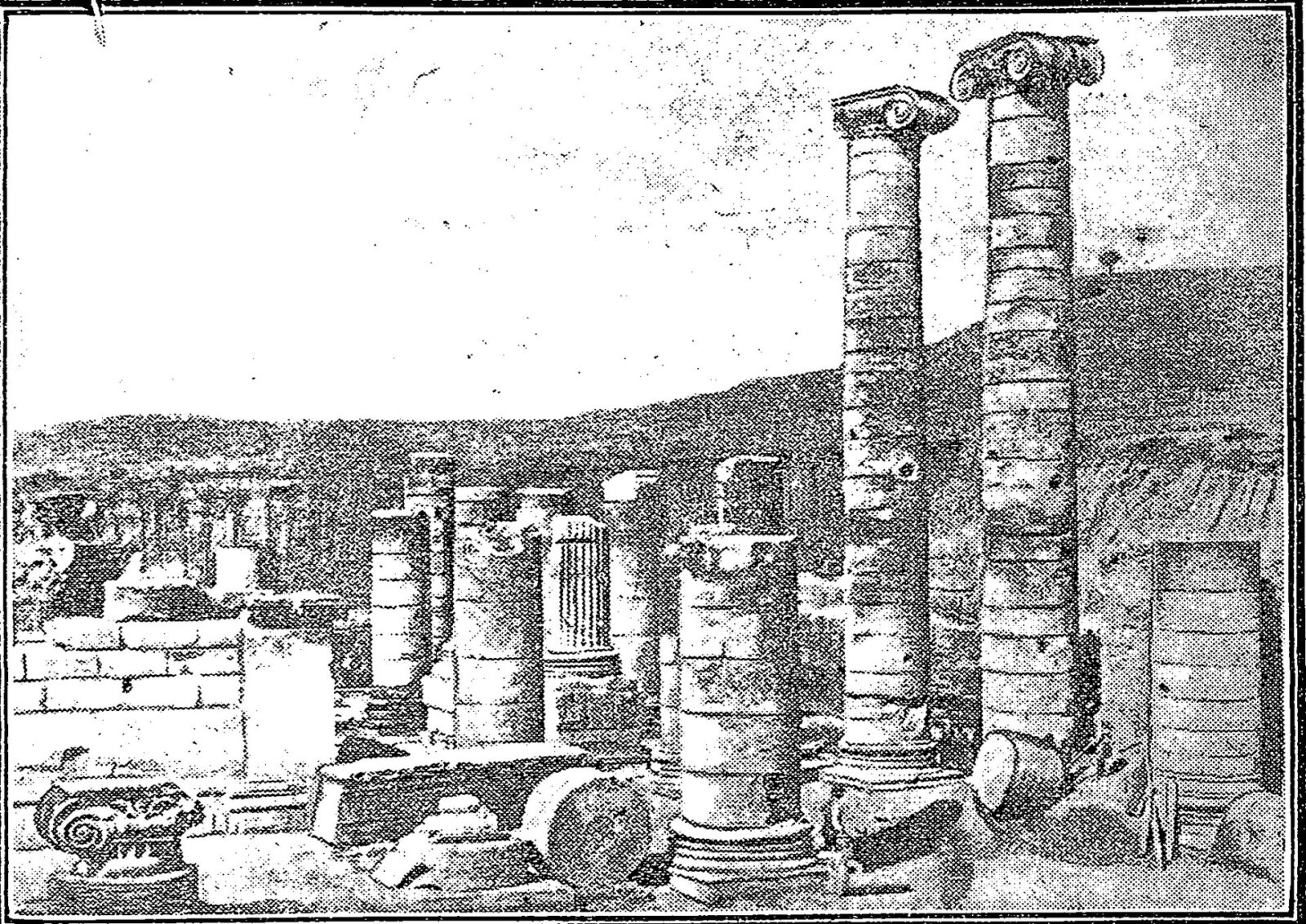 Two tall columns stand among the excavated ruins of the Temple of Artemis at Sardis.