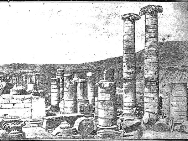Two tall columns stand among the excavated ruins of the Temple of Artemis at Sardis.