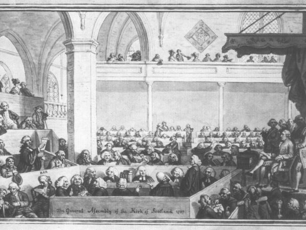 Commissioners fill the galleries and floor of the Tron Kirk as a speaker addresses the General Assembly.